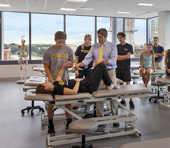 Students and instructor in physical therapy lab